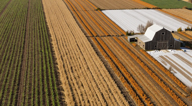 American farmland showing four seasons from spring planting to winter snow, illustrating the seasonal dating rhythm for farmers